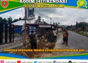 Semangat Gotong Royong: Babinsa Ranomeeto dan Warga Bersihkan Saluran Air Vital